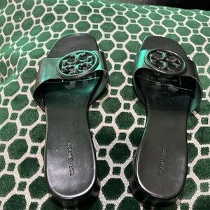 Tory Burch black slides with dust bag.